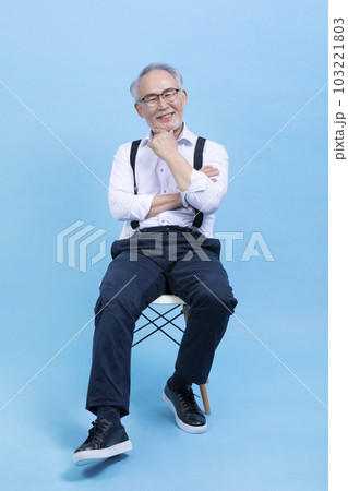 active young senior Korean Asian male sitting on the chair active young senior Korean Asian male sitting on the chair 103221803
