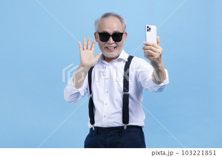 active young senior Korean Asian male on video chat, call 103221851