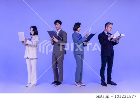 Asian Korean senior, middle aged and young male and female colleagues models in business attire, neon purple studio background, working 103221877