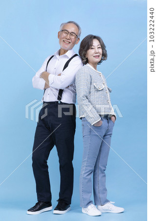 active young senior Korean Asian couple, man and woman standing back to back active young senior Korean Asian couple, man and woman standing back to back 103222440