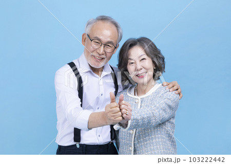 active young senior Korean Asian couple with hand motion active young senior Korean Asian couple with hand motion 103222442