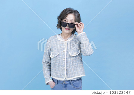 active young senior Korean Asian woman wearing sunglass active young senior Korean Asian woman wearing sunglass 103222547