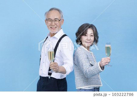 active young senior Korean Asian couple holding champagne glasses active young senior Korean Asian couple holding champagne glasses 103222786
