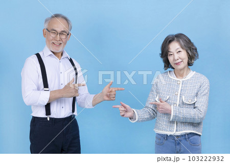 active young senior Korean Asian couple with hand motion 103222932