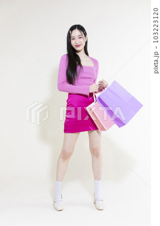 vintage y2k pink retro concept photo of korean asian cute woman holding shopping bags 103223120