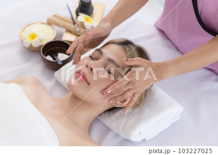 Young Asian Woman enjoying and relax massage in spa salon, Spa beauty massage healthy wellness , Lifestyle Healthy Concept. 103227025