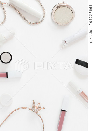 Frame background with flatley cosmetics on white. Makeup accessories lipstick mascara top view in pastel colors. Vertical template with copy space Frame background with flatley cosmetics on white. Makeup accessories lipstick mascara top view in pastel colors. Vertical template with copy space 103227661