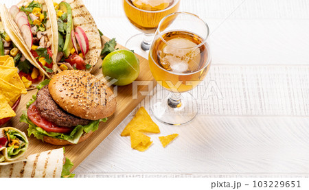 Mexican food featuring tacos, burritos, nachos, burgers 103229651