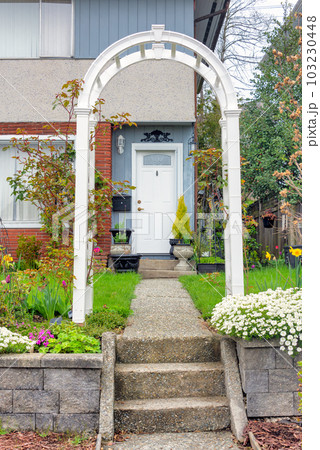 Steps and concrete pathway to the entrance of residential house Steps and concrete pathway to the entrance of residential house 103230448