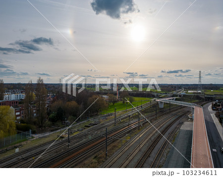 Aerial view shot by a drone of a cyclists and pedestrian bridge over the railroad tracks Aerial view shot by a drone of a cyclists and pedestrian bridge over the railroad tracks 103234611