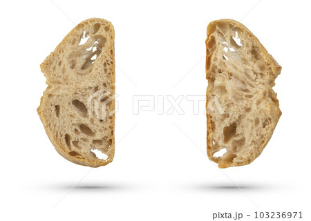 Two slices of fresh Ciabatta bread on a white isolated background. Slices hang or fall on a white background. The concept of Italian bread baking or delicious breakfast. Two slices of fresh Ciabatta bread on a white isolated background. Slices hang or fall on a white background. The concept of Italian bread baking or delicious breakfast. 103236971