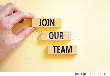 Join our team symbol. Concept words Join our team on wooden block on a beautiful white table white background. Businessman hand. Business and join our team concept. Copy space. 103237212