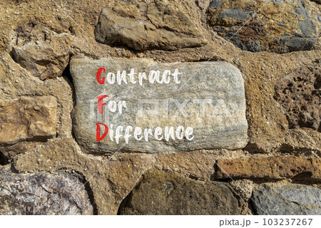 CFD symbol. Concept words CFD contract of difference on beautiful big stone in stone wall. Beautiful stone wall background. Business and CFD contract of difference concept. Copy space. 103237267