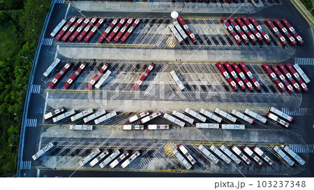 Bus depot red buses top-down view aerial drone shot 103237348