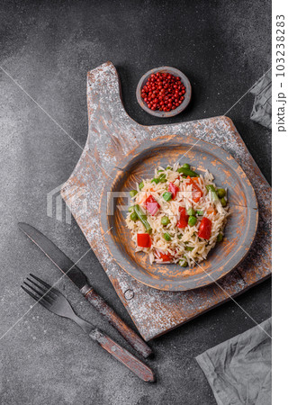 Delicious boiled rice with peppers, peas, asparagus beans and carrots Delicious boiled rice with peppers, peas, asparagus beans and carrots 103238283