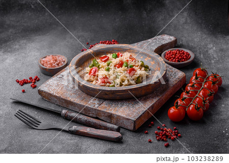 Delicious boiled rice with peppers, peas, asparagus beans and carrots 103238289