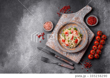 Delicious boiled rice with peppers, peas, asparagus beans and carrots 103238290