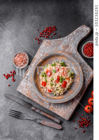 Delicious boiled rice with peppers, peas, asparagus beans and carrots 103238291