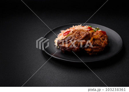 Delicious boiled rice with peppers, peas, asparagus beans and carrots and fried chicken 103238361