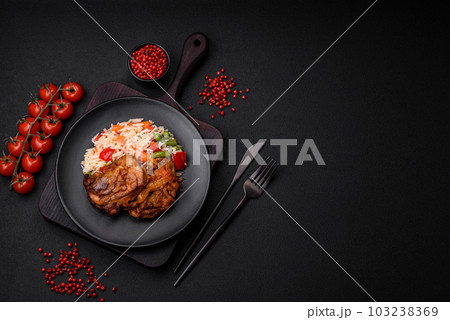 Delicious boiled rice with peppers, peas, asparagus beans and carrots and fried chicken Delicious boiled rice with peppers, peas, asparagus beans and carrots and fried chicken 103238369