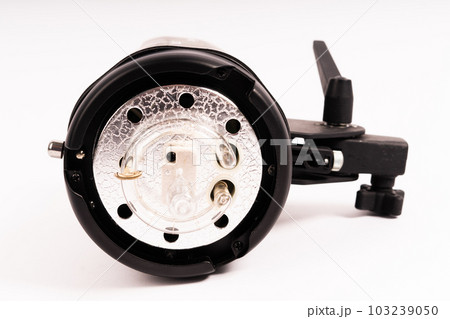 Studio light flash lamp closeup on white background isolated 103239050