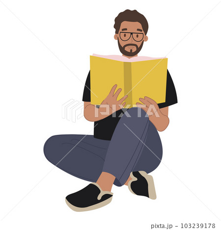 A modern bearded man in glasses reading a book. 103239178