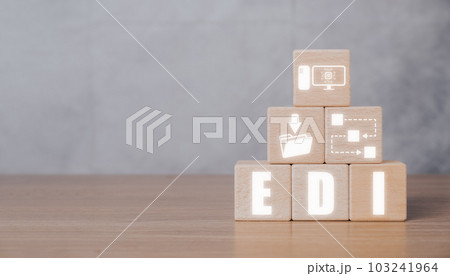 EDI, Electronic data interchange concept, Wooden block on desk with Electronic data interchange icon on virtual screen. 103241964