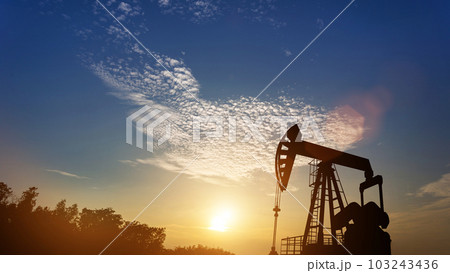 Oil pump oil rig energy industrial machine in Colorful dramatic sky 103243436