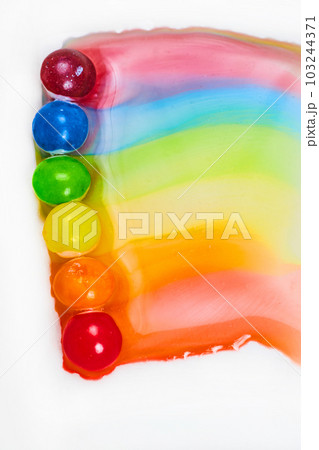Asset of skittles in rainbow streak on white background 103244371
