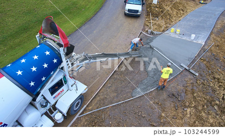 Construction cement truck driveway pour residential home area aerial asset Construction cement truck driveway pour residential home area aerial asset 103244599