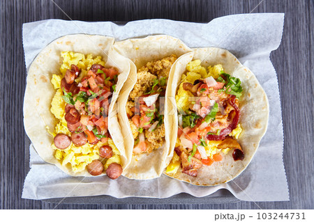 3 flour tortilla Mexican breakfast tacos sausage chorizo bacon with toppings background asset 3 flour tortilla Mexican breakfast tacos sausage chorizo bacon with toppings background asset 103244731