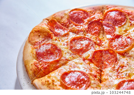 Small kids’ 10’ pepperoni cheese pizza food small on white plate white background asset Small kids’ 10’ pepperoni cheese pizza food small on white plate white background asset 103244748