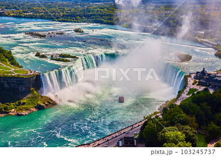 Detailed view of entire Niagara Falls Horseshoe Falls from above in Canada with tourist ship by falls 103245737