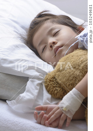 Little Asian Thai Girl, Recovering Sleep on white patient Bed . 103249681