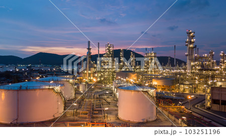 Aerial view white oil storage tank and oil refinery factory plant at night form industry zone, Oil refinery and petrochemical plant factory, Business oil and gas industrial factory power and energy. 103251196