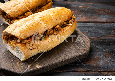Tantuni, Traditional Turkish Kebap with Chicken, on old dark wooden table background, with copy space for text Tantuni, Traditional Turkish Kebap with Chicken, on old dark wooden table background, with copy space for text 103252798