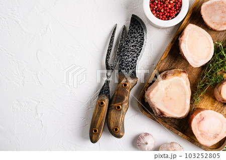 Beef Bones for Making Broth, on white stone table background, top view flat lay, with copy space for text Beef Bones for Making Broth, on white stone table background, top view flat lay, with copy space for text 103252805