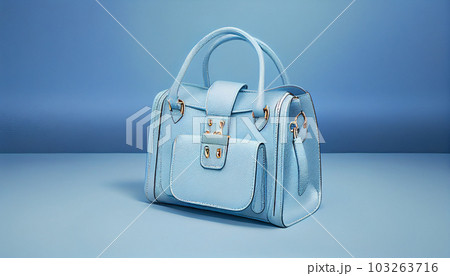 Beautiful trendy smooth youth women's handbag in gentle blue color on a light blue studio background. Generate Ai. Beautiful trendy smooth youth women's handbag in gentle blue color on a light blue studio background. Generate Ai. 103263716