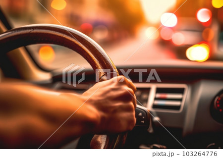 A close-up image of a driver's hand firmly gripping the steering wheel as their car overtakes, with a blurred background, focusing on the driver's determination and control. Generative AI 103264776