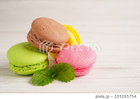 Macaron or french macaroon dessert, cake and cookies on the celebrated birthday. Macaron or french macaroon dessert, cake and cookies on the celebrated birthday. 103265754