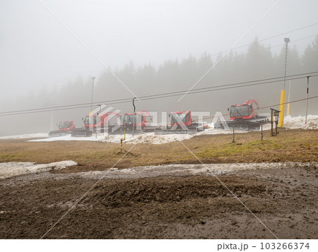 Red tractor, snow plough parked outside Ore mountain Red tractor, snow plough parked outside Ore mountain 103266374
