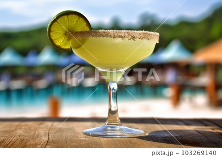 A shot of a frozen margarita in a salt-rimmed glass, against a beach or poolside setting, conjuring up images of vacations and relaxation. Generative AI A shot of a frozen margarita in a salt-rimmed glass, against a beach or poolside setting, conjuring up images of vacations and relaxation. Generative AI 103269140