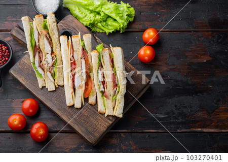 Homemade chicken sandwich, on old wooden table, top view with copy space for text 103270401