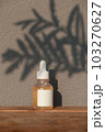Vitamin C Serum Dropper matt glass Bottle Mock-Up with a leaf shadow. Body treatment and spa. Natural beauty products. Eco cream, serum, skin care yellow serum blank bottle 103270627