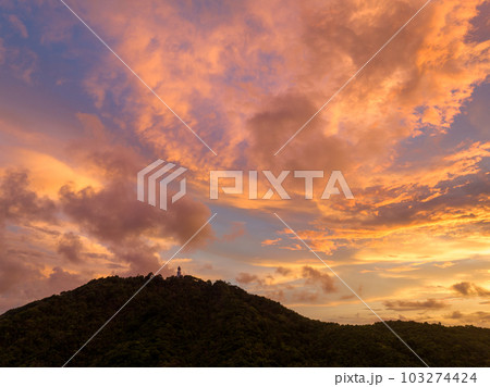 aerial view Bright golden yellow clouds dazzle the sky at sunrise. Bright red-orange sky, beautiful beyond imagination. drone shooting stunning sky full of colorful cloud. abstract nature background. 103274424