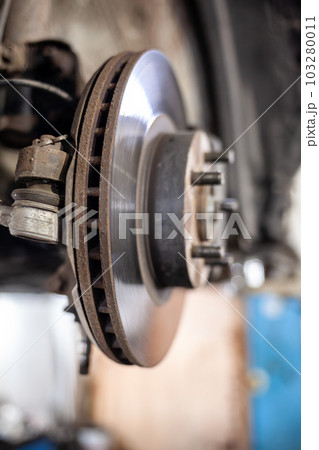 Disc brake of the vehicle for repair, in process of tire replacement 103280011