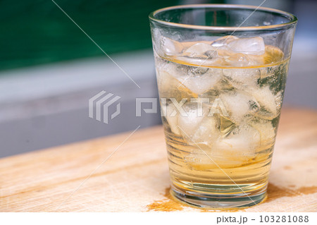 Ice liquid in the glass. Ice cube Ice liquid in the glass. Ice cube 103281088