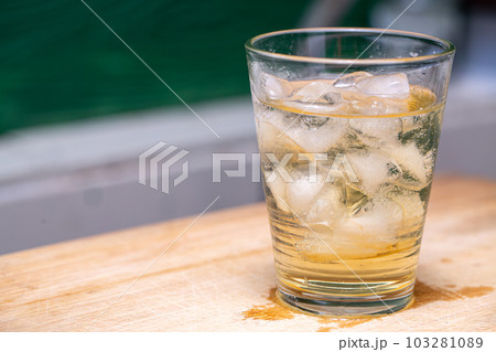 Ice liquid in the glass. Ice cube 103281089