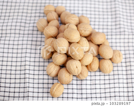 A lot of whole walnuts on a napkin. Healthy, organic and healthy food 103289197