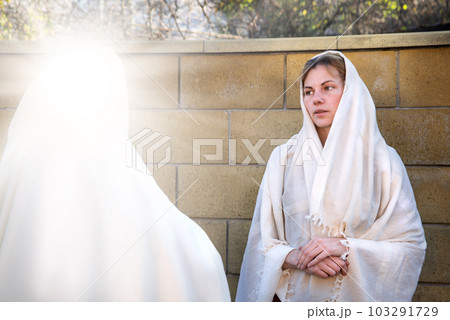 A woman in ancient clothes speak with friend A woman in ancient clothes speak with friend 103291729